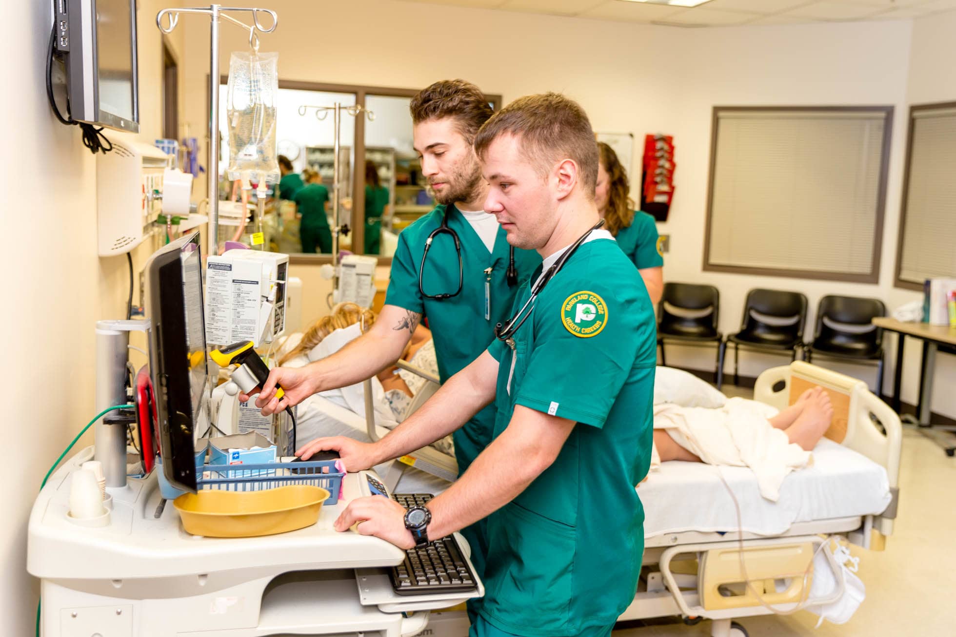 male nursing students at computer